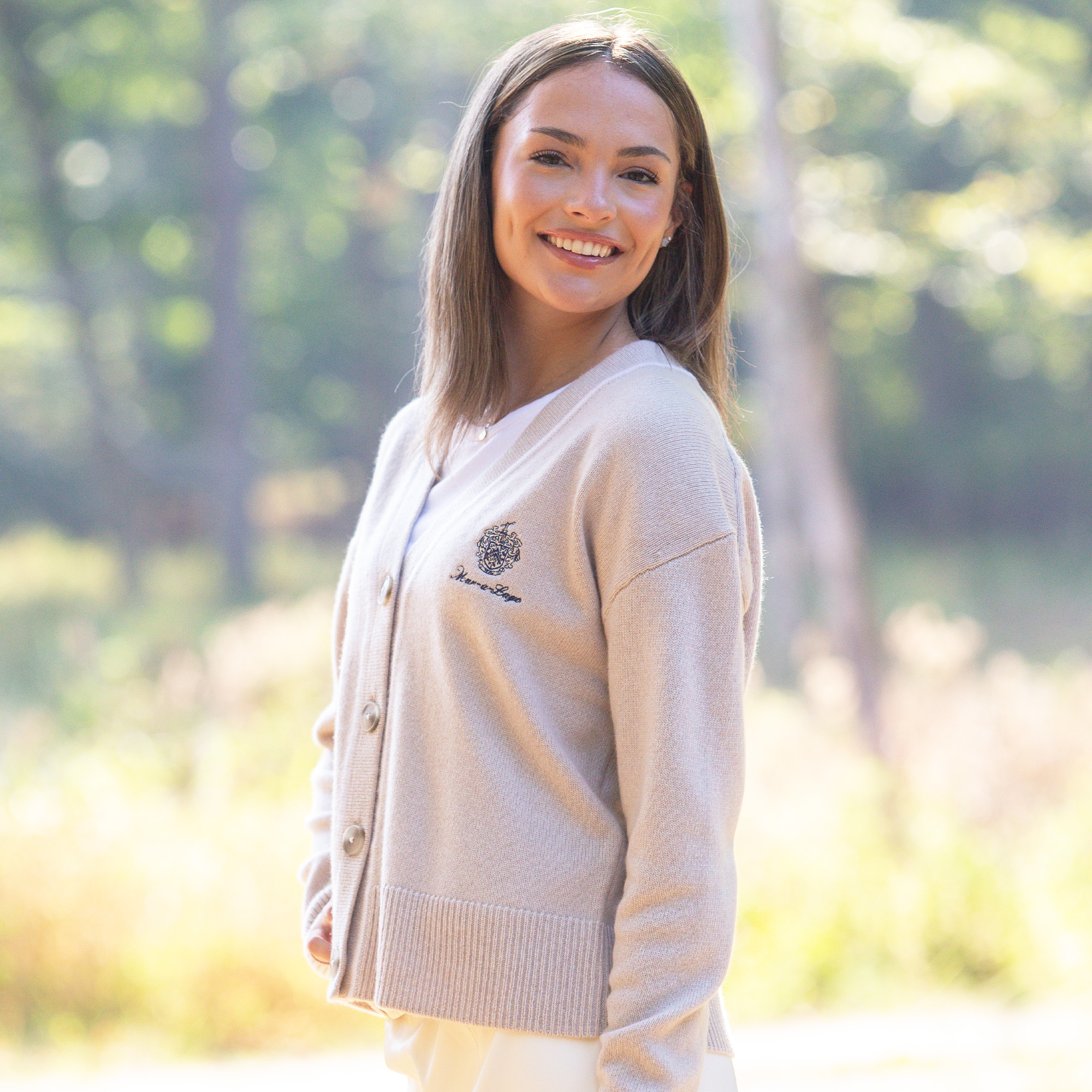 Female model wearing the Ladies Mar-a-Lago Cashmere Cardigan in the colors toasted and sea salt Female model wearing the Ladies Mar-a-Lago Cashmere Cardigan in the colors toasted and sea salt